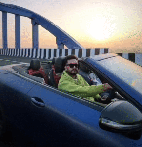 Elvish Yadav with his Mercedes-Benz AMG E53 Cabriolet luxury convertible car